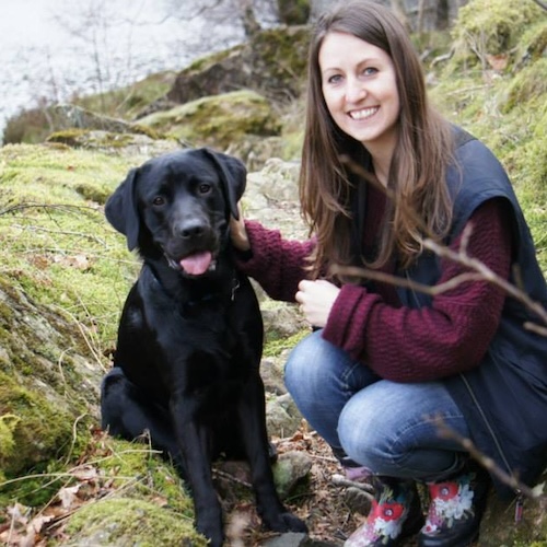 Photo of Debbie in the woods with her dog Brody